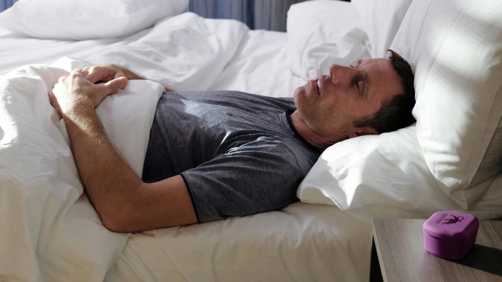 Patient sleeping comfortably while wearing a custom oral appliance